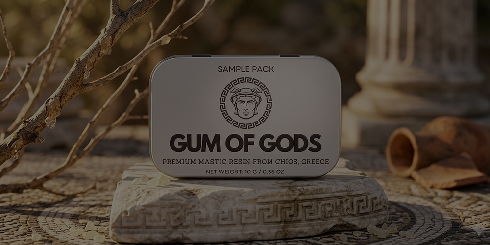 Gum of Gods tin on a stone block beside ancient Greek columns